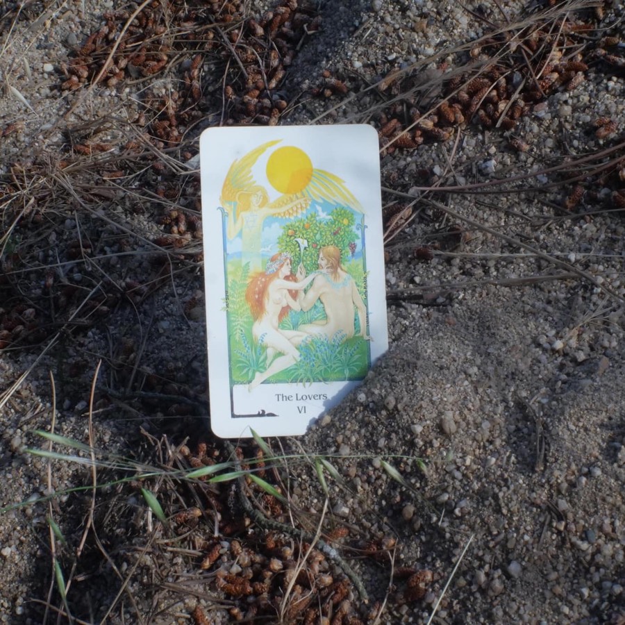 The The Lovers tarot card photographed outdoors